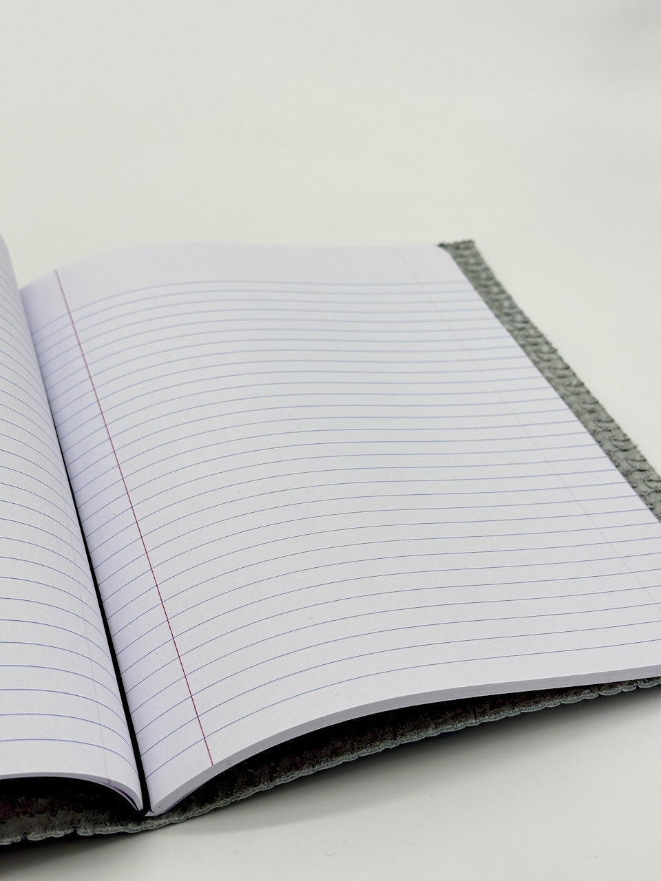 interior of the blanked lined paper pages of the notebook insert for the leather journal