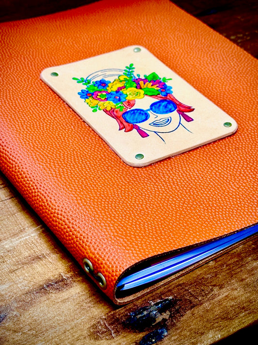 corner angle of orange basketball leather refillable journal from Undercover Popular Leather Goods