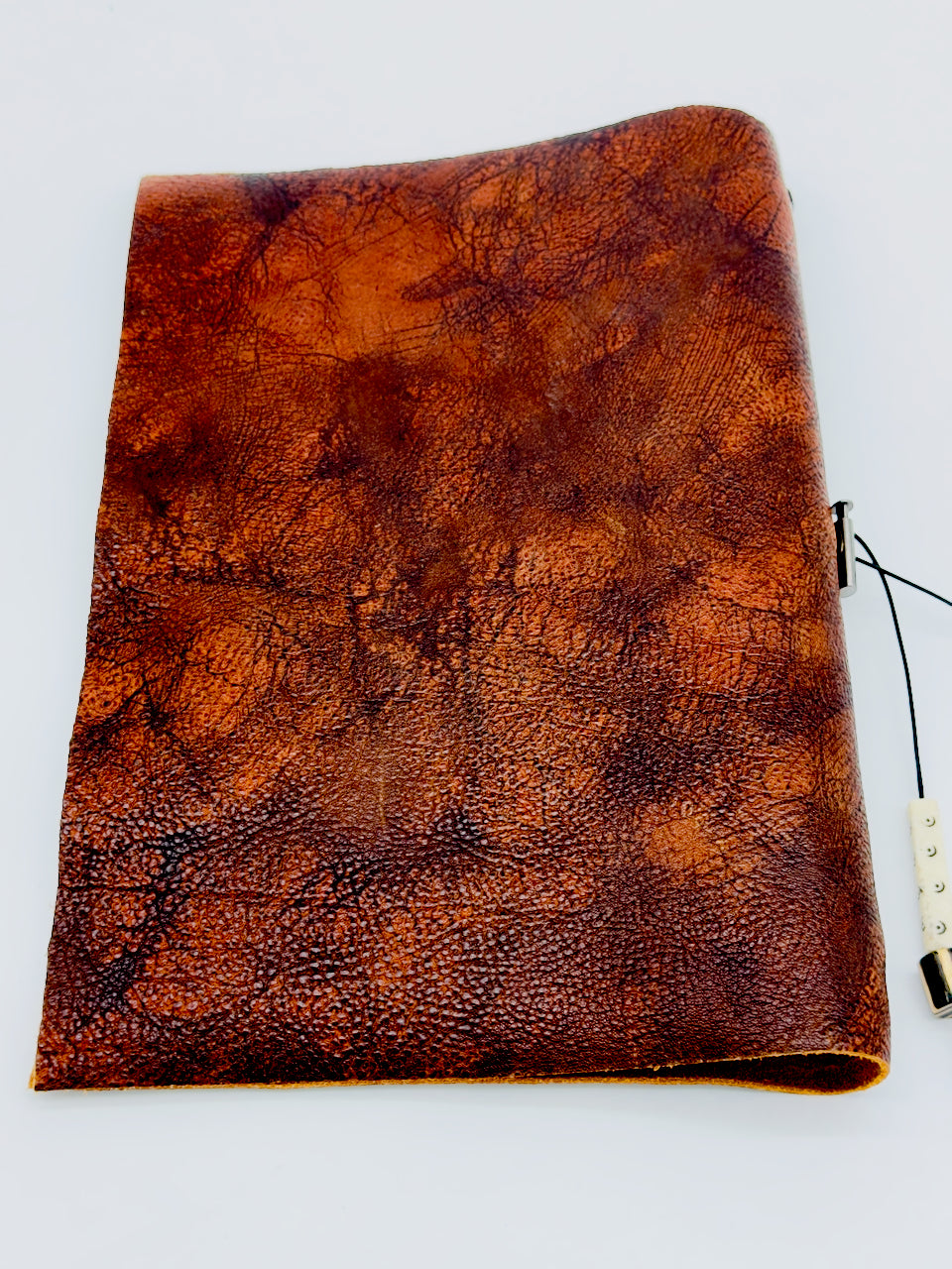 back cover of distressed brown leather journal
