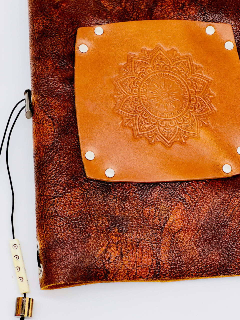 beautiful embossed mandala on distressed leather journal