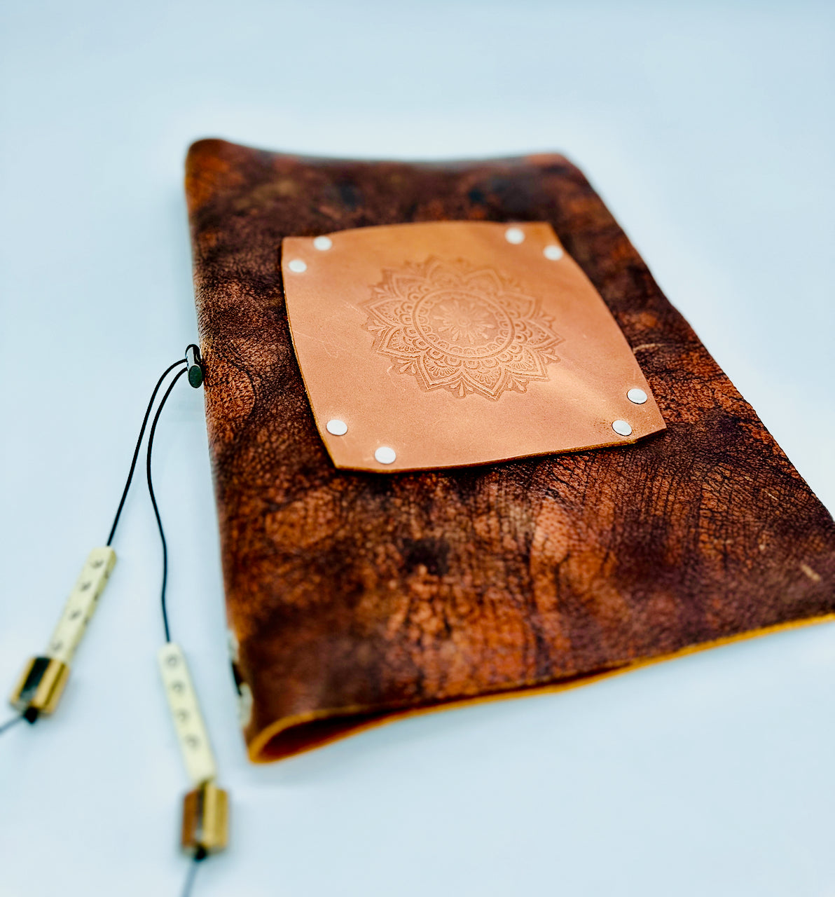 leather journal front cover with embossed mandala patterned image